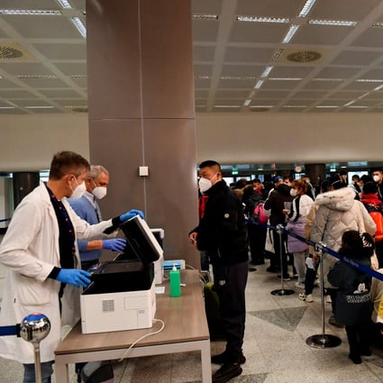Passengers wait in a queue at Malpensa Airport in Milan, Italy on Thursday after Italy ordered Covid-19 tests for all travellers coming from China. Photo: Reuters