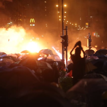 Anti-government protesters clash with riot police on Nathan Road, Yau Ma Tei in 2019. Photo: Winson Wong