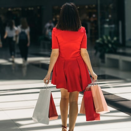 Woman shops at a busy mall. Photo: Shutterstock/File
