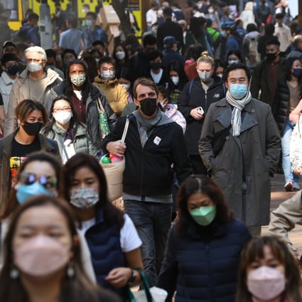 ‘Hong Kong’s Covid count could be 200,000, border risks small’ 2 Commuters in Hong Kong’s Causeway Bay. The city has been reporting daily Covid caseloads of more than 20,000. Photo: Edmond So