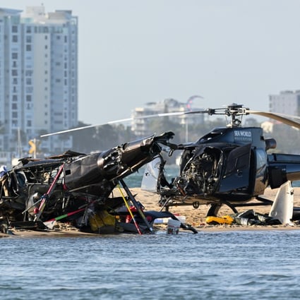 One helicopter lay flipped over on the sand a few feet from the shore. The other chopper appeared to be largely intact at the accident scene. Photo: EPA-EFE