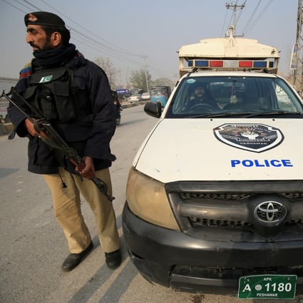 Pakistani security officials stand guard on December 24 at a checkpoint following a security high-alert, a day after a suicide blast in Islamabad. Pakistan’s civil and military leadership late Monday issued a warning that “the full force of the state” would “take on all and any entities that resort to violence”. Photo: EPA-EFE