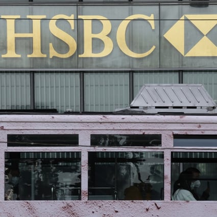 A tram passes by HSBC’s main building in Central. Photo: Jonathan Wong