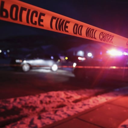 Police tape surrounds the crime scene in Enoch, Utah, where eight members of a family were killed. Photo: AP