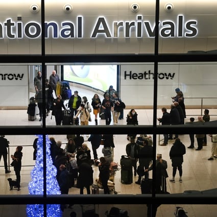 Travellers at Heathrow Airport in London on Wednesday. The UK is requiring people arriving from China to show a negative Covid-19 test taken no more than two days before their departure. Photo: EPA-EFE