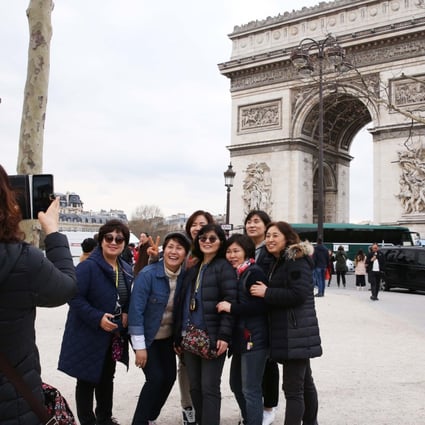 Chinese tourists in Paris. Exports do not expect them to return to luxury shopping hubs such as the French capital any time soon – high-end spenders have got used to buying at home. Photo: Xinhua