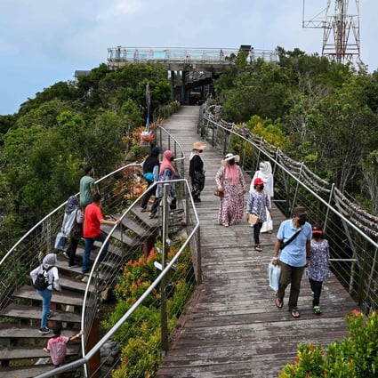 Visitors walk up to the lookout point near the Langkawi Skycab cable car. Photo: AFP 