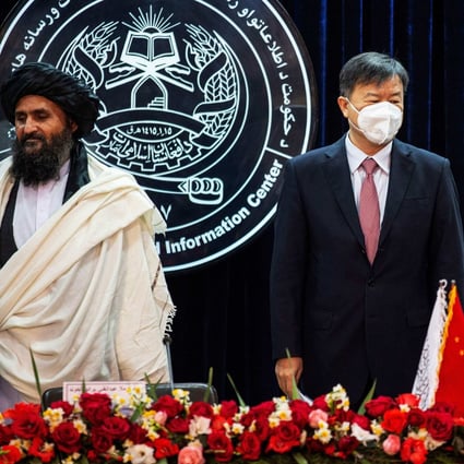 Afghanistan’s acting first deputy prime minister Abdul Ghani Baradar (left) and China’s ambassador to Afghanistan Wang Yu attend a press conference to announce an oil extraction contract with a Chinese company in Kabul on January 5, 2023. Photo: AFP