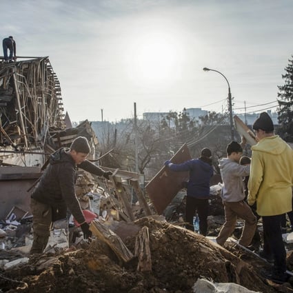 Volunteers remove debris on Tuesday from the site of a Russian missile attack in Kyiv. Photo: EPA-EFE