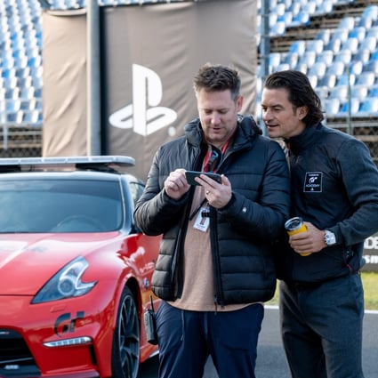 Orlando Bloom (right) and director Neill Blomkamp on the set of “Gran Turismo”. Sony is teasing the film at the CES 2023 technology trade show this week. Photo: Gordon Timpen/via Reuters