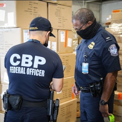 US Customs and Border Protection officers in Atlanta inspecting apparel suspected to have been made with cotton harvested by forced labour in China’s Xinjiang region. Photo: US Customs and Border Protection