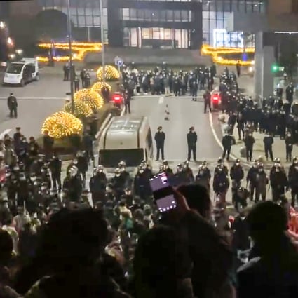 Riot police and workers appear to have clashed at a Covid test kit plant in Chongqing on Saturday. Photo: Twitter
