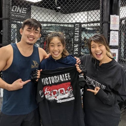 Christan Lee (left) and Angela Lee (right) with younger sister Victoria Lee at their family’s United MMA Hawaii gym. Photo: Instagram