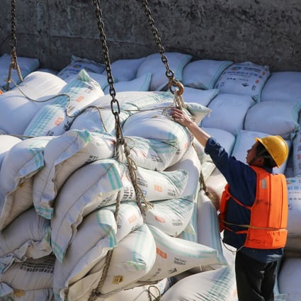 Bags of imported soybean meal are handled at a port in China’s Jiangsu province. Photo: AFP