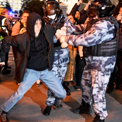 Police officers detain a man in Moscow in September 2022, following calls to protest against the partial mobilisation announced by President Vladimir Putin. Photo: AFP