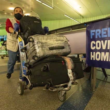 A traveller at Tom Bradley International Terminal at Los Angeles International Airport on January 9. The United States requires travellers from China, including Hong Kong and Macau, to take a Covid-19 test no more than two days before travel. Photo: Bloomberg 