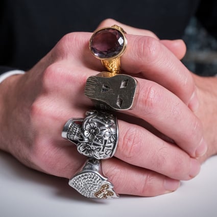 Victor Gastou wears four of the rings from his late father Yves Gastou’s collection of more than 1,000. He has chosen more than 300 for an exhibition in Hong Kong. 