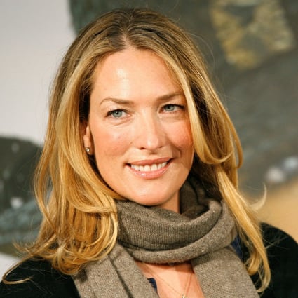 German model Tatjana Patitz smiles as she presents the new catalogue of the Otto group in Hamburg in December 2006. Photo: Reuters