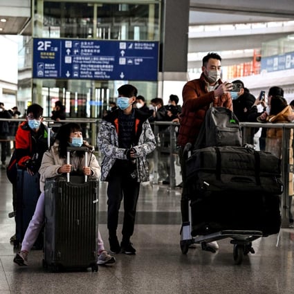 International arrivals make their way out of Beijing airport as entry restrictions are lifted on  January 8. Photo: AFP