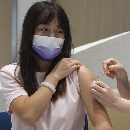 A patient receives a dose of the bivalent vaccine at a private clinic in Tsim Sha Tsui. Photo: Sam Tsang