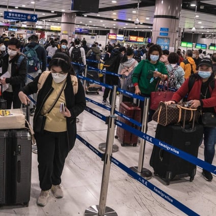Travellers queue in the border control area at Lok Ma Chau station on January 8, the first day the border with the mainland was reopened for quarantine-free travel. Photo: Bloomberg