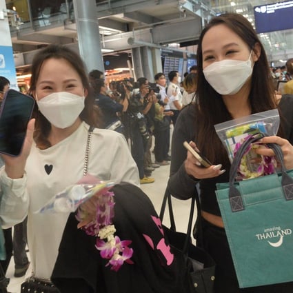 Chinese passengers arrive at the Suvarnabhumi Airport in Samut Prakan, Thailand, on Monday following China’s lifting of the travel ban. Photo: Xinhua