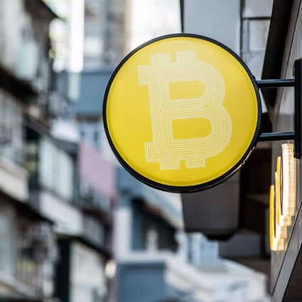 A Bitcoin logo in Hong Kong. Crypto assets could be useful to society if a gambling tax is imposed on turnover, much like stamp duty on stock transaction. Photo: Bloomberg 