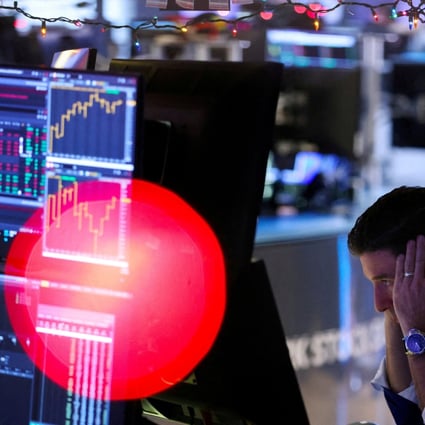 FILE PHOTO: A trader works on the trading floor at the New York Stock Exchange in December 2022. Photo: Reuters