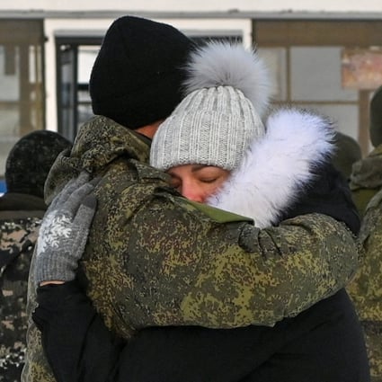 A Russian reservist called up in Putin’s partial mobilisation bids farewell to relatives and acquaintances in Omsk on January 6. Photo: Reuters