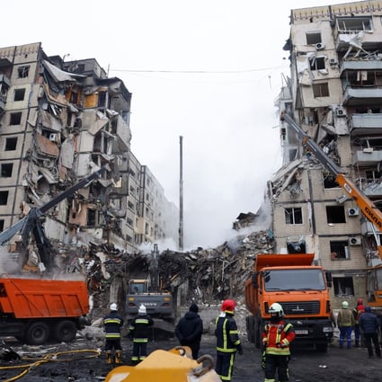 Emergency personnel work at the site where an apartment block was heavily damaged by a fatal Russian missile strike, in Dnipro, Ukraine. Photo: Reuters