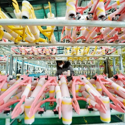 A worker arranges bike frames in a factory producing bicycles and baby strollers in Pingxiang county, in north China’s Hebei province, on December 27, 2022. Photo: Xinhua
