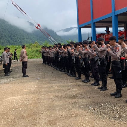 Police shows take up positions after two workers, including a Chinese national, were killed at a nickel smelting plant in North Morowali, Sulawesi after a riot broke out during a protest over labour conditions. Photo: Morowali Police/AFP/Handout