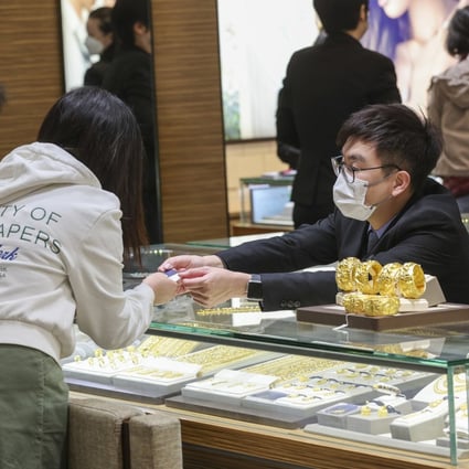 Customers buying gold jewellery at a jewellery shop in the New Town Plaza in Sha Tin. Photo: Yik Yeung-man