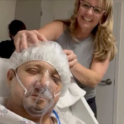 Jeremy Renner gets his head massaged during a hospital stay at an unknown location following a snow plough accident in this screen grab from a social media video on January 5. Photo: Twitter / Jeremy Renner via Reuters