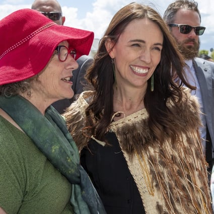 Jacinda Ardern has her photo taken with a supporter on Tuesday during her final public appearance as New Zealand’s prime minister. Photo: New Zealand Herald via AP