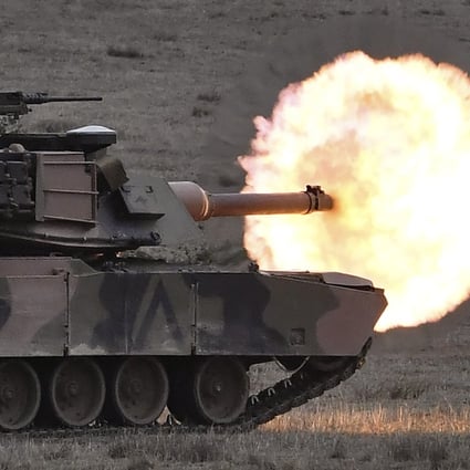 An Australian army M1A1 Abrams main battle tank fires a round at a target at the Puckapunyal Military Base north of Melbourne in May 2019. Photo: AFP