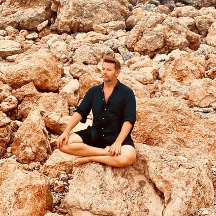 Chris Connors meditates in Ibiza, Spain. As well as running expensive retreats there for executives, the former fashion entrepreneur has developed a free app called OPO to share the benefits of meditation with more people. Photo: Chris Connors
