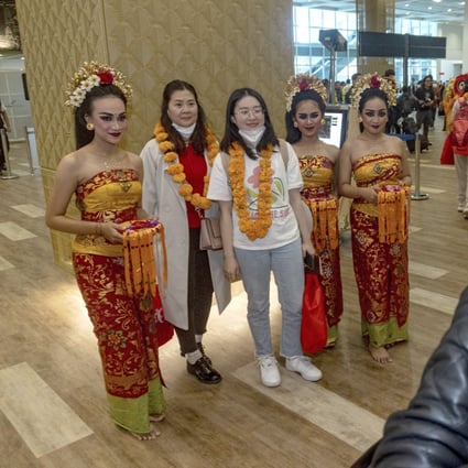 Local dancers welcome China tourists to Bali at the island’s main airport. Photo: Xinhua
