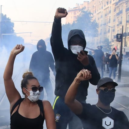 Protesters gesture during a demonstration against police violence and racial injustice in Paris in June 2020. Photo: AP