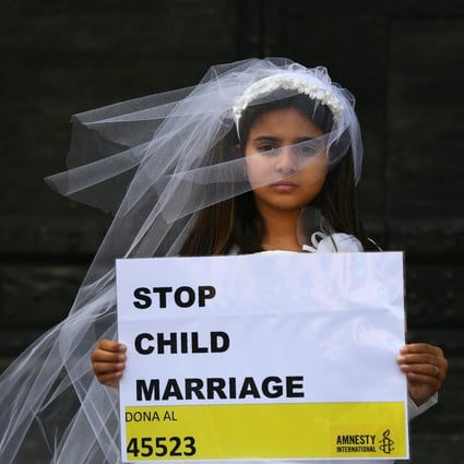 A young actress plays the role of an underage bride as part of an event organised by Amnesty International. Photo: AFP