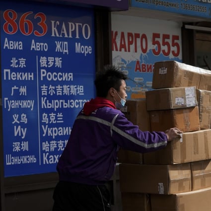 A delivery worker pushes packages through an area known as the Russian Market in Beijing. Mainland China and Hong Kong are said to have supplied around 40 per cent of Russia’s total computer chips last year. Photo: AP