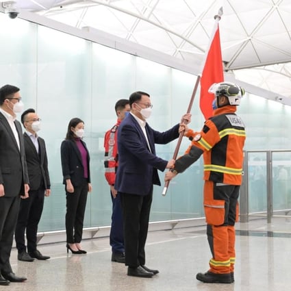 Acting chief executive Eric Chan sees the search and rescue team off at Hong Kong International Airport on Wednesday night. Photo: Handout 