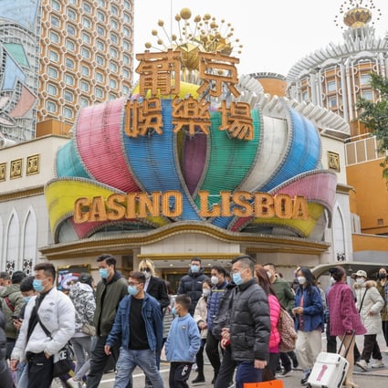 People walk in front of the Casino Lisboa Hotel in Macau on January 17. Photo: Yik Yeung-man
