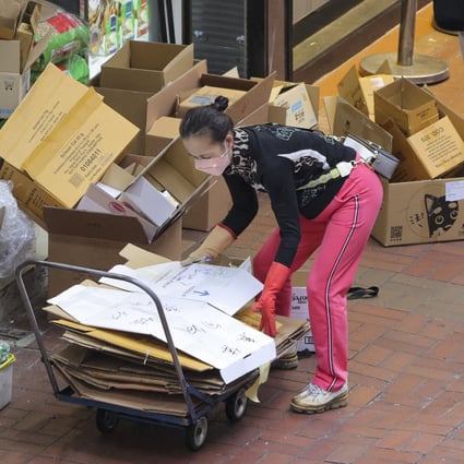A woman collects cardboard in Mong Kok on January 10. For many low-wage earners, life was already difficult before Covid-19 exacerbated the situation. Photo: Jelly Tse