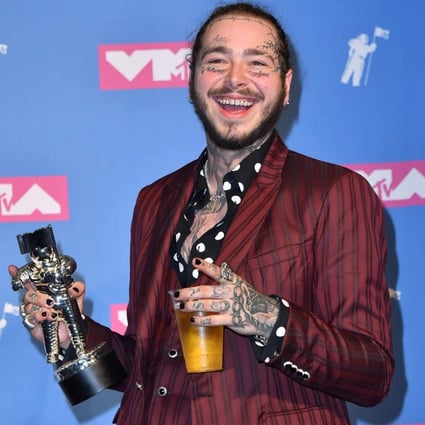 US singer Post Malone denied entry into Australia bar over his tattoos ...