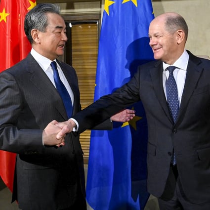 German Chancellor Olaf Scholz (right) greets top Chinese diplomat Wang Yi at the Munich Security Conference in Munich, Germany, on Friday. Photo: AFP