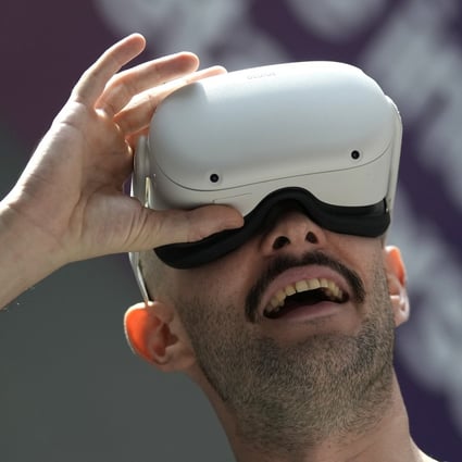A man experiences a virtual reality headset during the Dubai Metaverse Assembly at the Emirates Towers, in Dubai on September 28. Photo: AP
