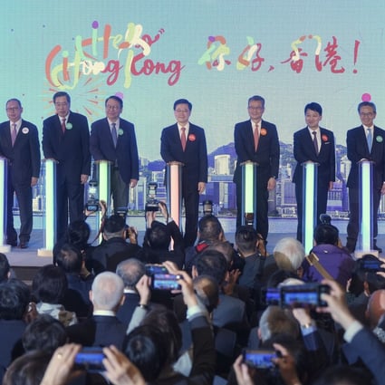 Chief Executive John Lee Ka-chiu (centre) is joined by government officials and heads of tourism bodies at the “Hello Hong Kong” campaign launch ceremony on February 2. Photo: Elson Li