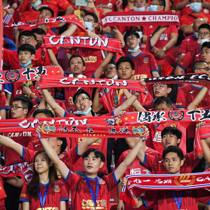 Fans cheer for their team during the Chinese Super League football match between Guangzhou FC and Guangzhou City in 2021. Photo: AFP