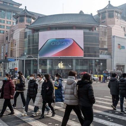 Pedestrians pass an Apple store in the Wangfujing shopping area in Beijing, on February 10. MNCs in China’s big market are having to cope with the souring of Western attitudes towards China, a relatively new and unexpected phenomenon. Photo: Bloomberg